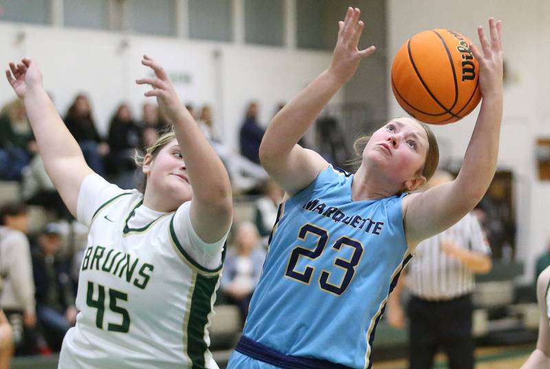 Marquette's Kelsey Cuchra grabs a rebound over St. Bede's Savannah Bray on Monday, Dec. 2, 2024 at St. Bede Academy.