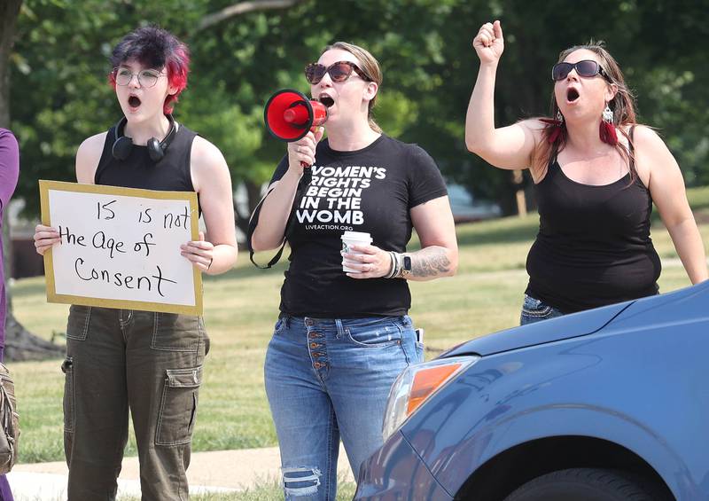 Protesters speak out Wednesday, June 14, 2023, in front of the DeKalb County Courthouse in Sycamore. The group is asking for harsher sentences for those convicted of domestic or sexual abuse. They gathered shortly after the arraignment hearing of Timothy M. Doll, a registered sex offender charged with murder in DeKalb teenager Gracie Sasso-Cleveland’s death.