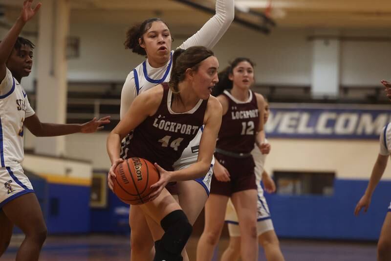 Lockport’s Alaina Peetz looks for a play against Joliet Central.