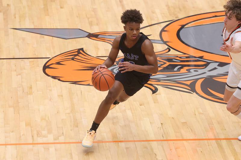 Lincoln-Way East’s BJ Powell works the ball midcoast against Lincoln-Way West on Tuesday, Jan. 16th, 2024 in New Lenox.