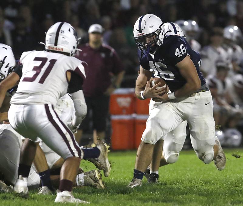 Cary-Grove's Logan Abrams runs with ball during a Fox Valley Conference football game against  Prairie Ridge on Friday, Sept. 22, 2023, at Cary-Grove High School in Cary.