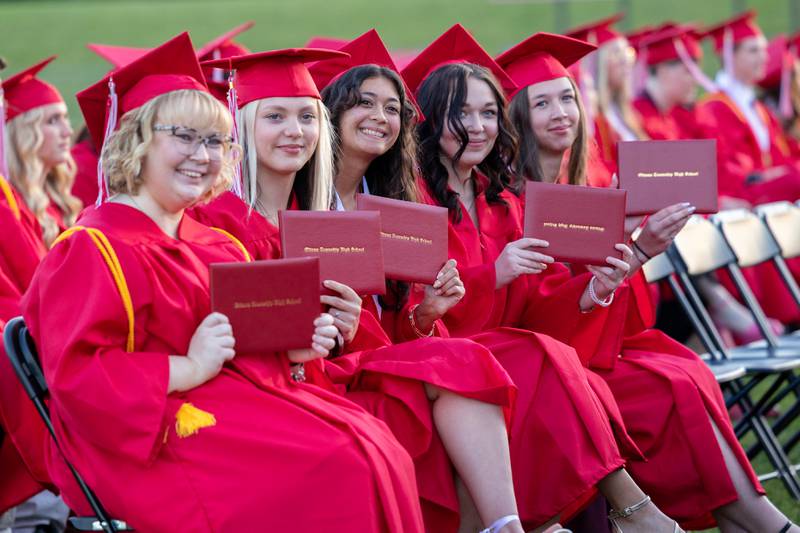(left to right) Kara Power, Jocelyn Quantro, Shaylen Quinn, Neenah Radovanovic and Nahela Ragan hold diplomas on Friday May 23, 2025 at Ottawa High School in Ottawa.