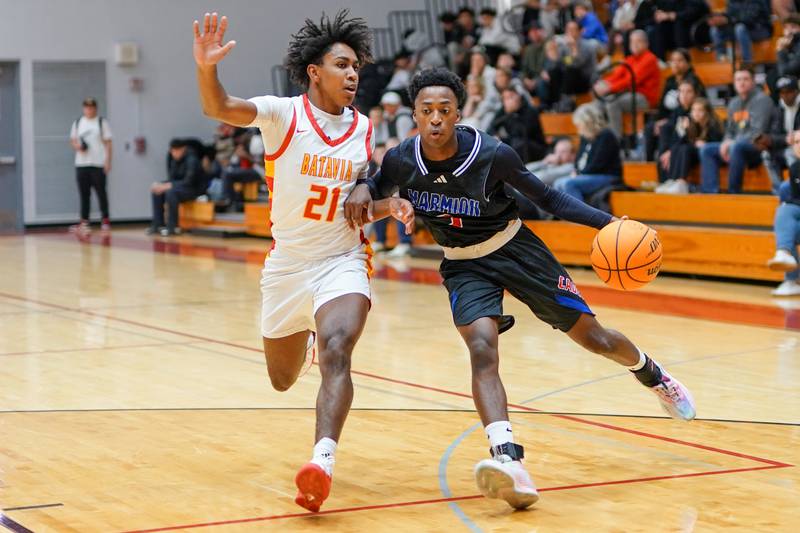 Marmion's David Malley (3) drives to the basket against Batavia’s Xavier Justice (21) during a game at Batavia High School on Wednesday, Nov. 26, 2025.