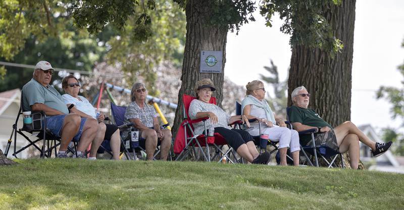 Fans watch from the hill at Sewards Park Saturday, July 12, 2025, as races speed through the oval track at Rock Falls’ River Chase.
