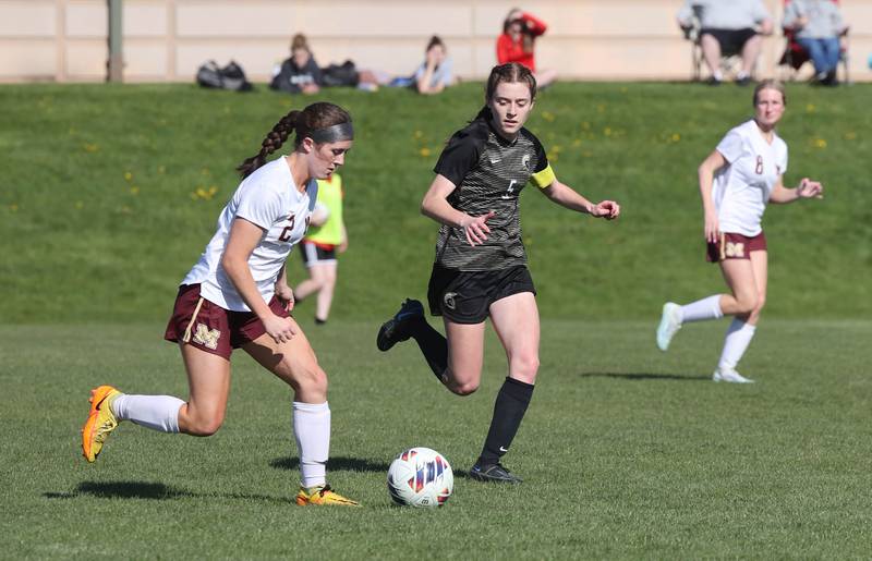 Morris' Ella McDonnel pushes the ball past Sycamore's Grace Parks during their Interstate 8 Conference Tournament semifinal game Wednesday, May 3, 2023, at Sycamore High School.