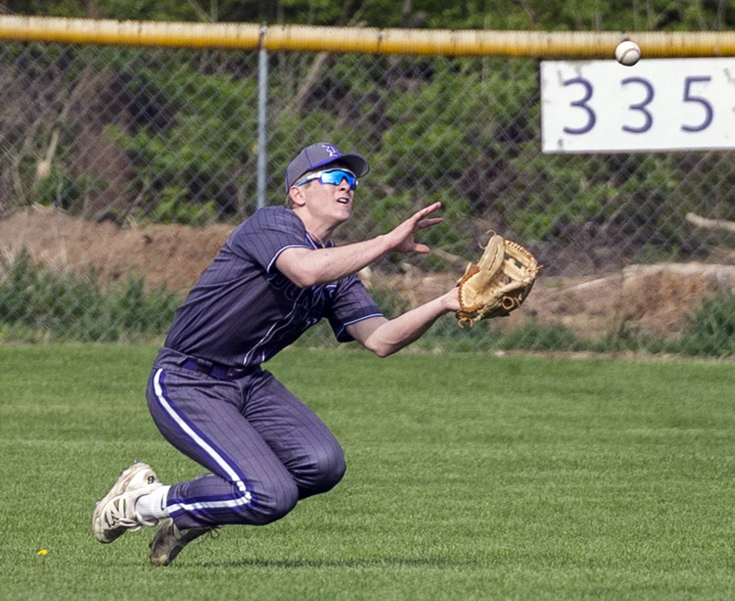 Dixon’s Jake Whelan comes in to make a sliding catch against Oregon Thursday, April 24, 2025.
