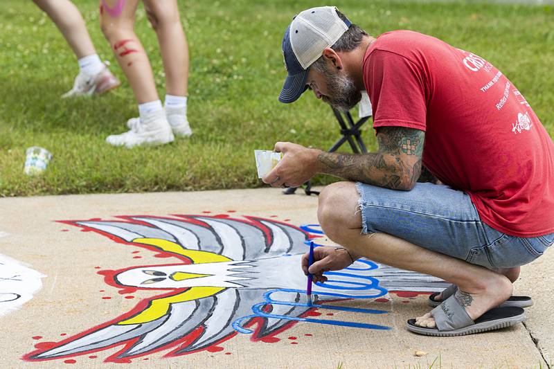 Kevin Hopper puts the final touches on his ultra-American work of art Thursday, July 4, 2024 for Discover Dixon’s Brush and Bloom event on the square of the old Lee County Courthouse.