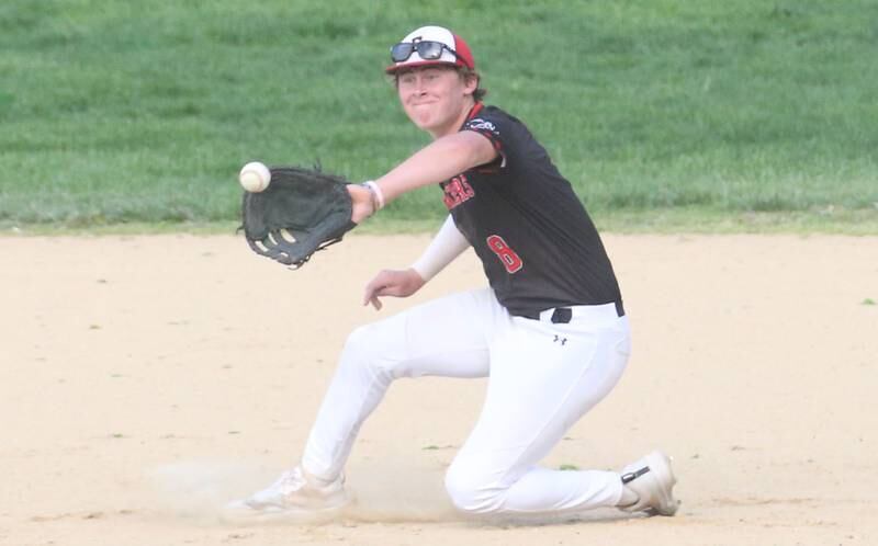 Erie-Prophetstown's Evan Steimle makes a diving catch on Monday, April 28, 2025 in Foley Field at Kirby Park in Spring Valley.