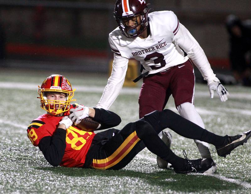 Batavia’s Brett Berggren makes a catch away from Brother Rice’s Donovan Brown during a Class 7A round 1 playoff game in Batavia on Friday, Oct. 27, 2023.