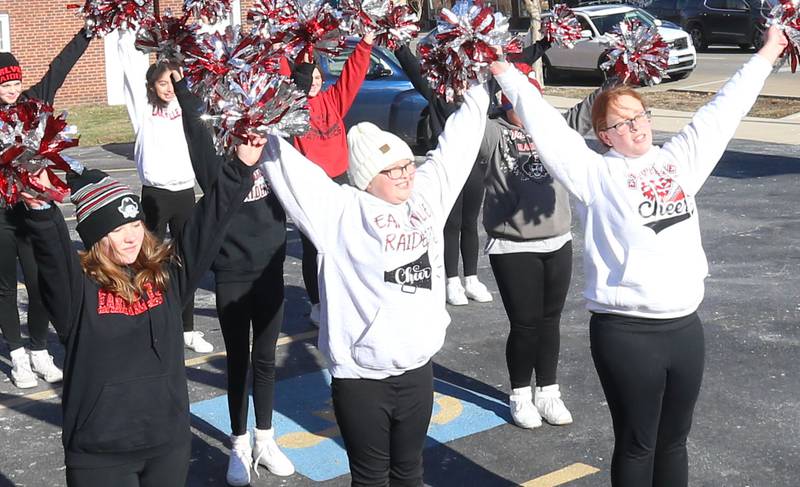 Earlville Jr. High cheerleaders perform a routine during the annual Freezin' for a Reezin' event on Friday, Dec. 6, at the corner of La Salle and Lafayette Street downtown Ottawa. The all-day event to helps the Ottawa Community Food Basket.