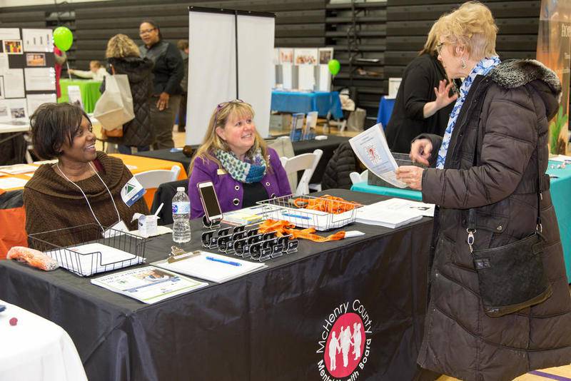 Members of the McHenry County Mental Health Board talk with a visitor Saturday, Jan. 26, 2019, during the 18th annual People in Need Forum at McHenry County College. The event featured more than 100 community resource exhibitors and several workshops.