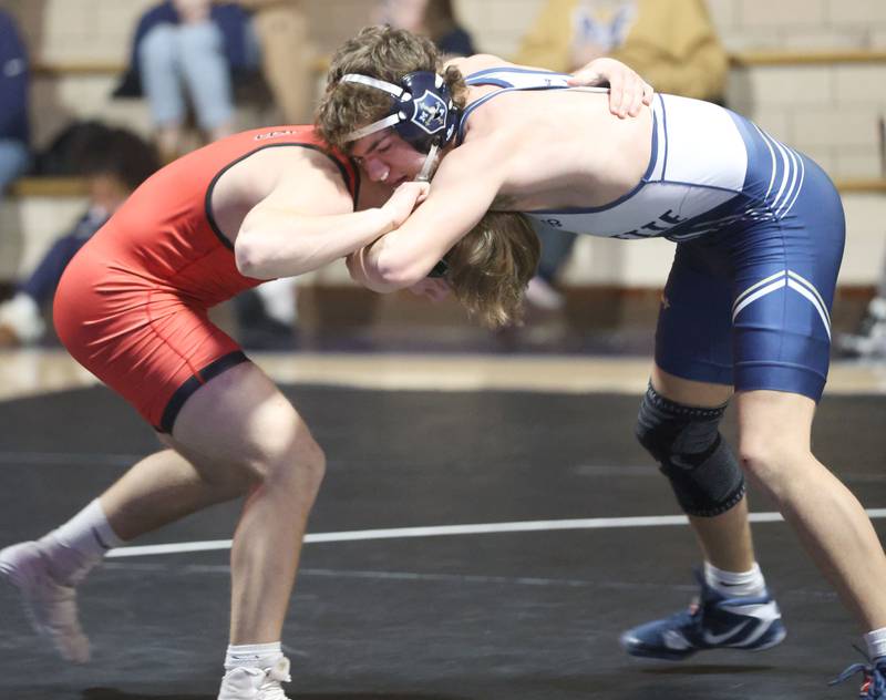 Marquette's Zane Waters wrestles Bradley-Bourbonnias's Billy Sanderson on Wednesday, Jan. 14, 2026 in Bader Gymnasium at Marquette Academy.
