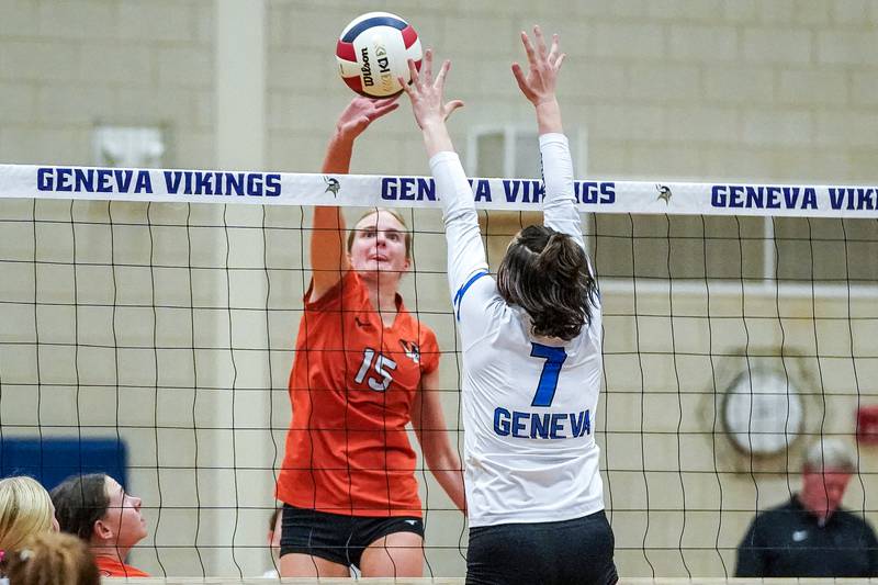 Wheaton Warrenville South's Katie Dragas (15) plays the ball at the net against Geneva’s Jordan Davenport (7) during a DuKane Conference match in Geneva on Tuesday, Sept. 16, 2025.