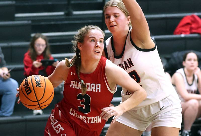 Aurora Christian’s Evelyn Klimek drives by Indian Creek's Madison Boehne during their game Monday, Nov. 25, 2024, at Indian Creek High School in Shabbona.