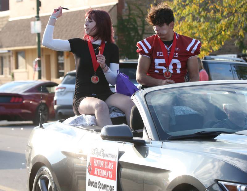 Hall senior attendants Brooke Spoonmore and Leo Lopez ride in the Hall High School Homecoming parade on Thursday, Sept. 28, 2023 in Spring Valley.
