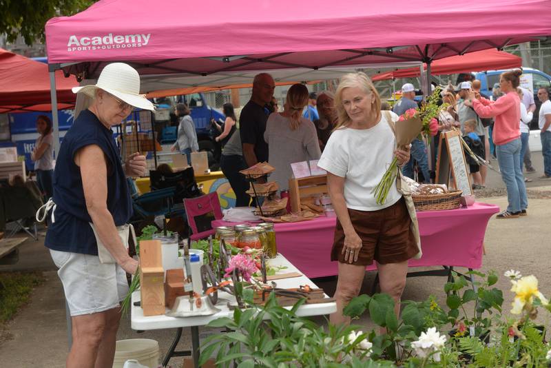 Bev Olson of Byron (left) was one of the vendors selling plants at the  River's Edge Farmers Market on Thursday, June 5, 2025. The markets are held each Thursday night from 5-7:30 p.m. at 123 N. 2nd St., along the riverfront below the Oregon dam on the west bank of the Rock River. The weekly events also include music, kids activities, and food booths.