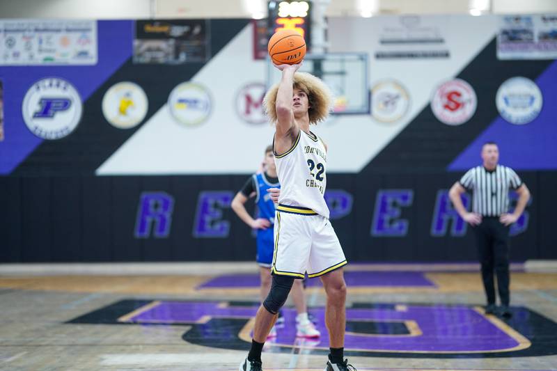 Yorkville Christian's Noah Aguado (22) shoots a one handed free-throw during a basketball game in the opening round of the 61st annual Plano Christmas Classic against Hinckley-Big Rock at Plano High School on Monday, December 23, 2024.