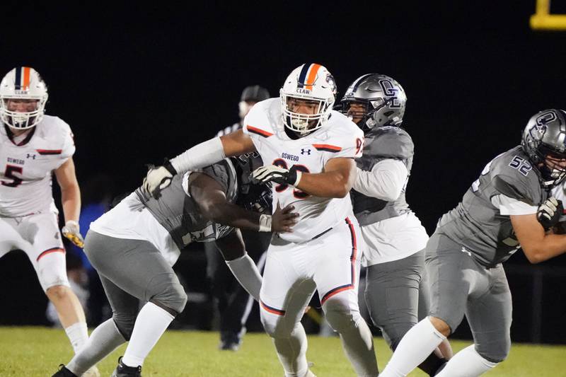 Oswego’s Christian Taylor (93) during a football game against Oswego East at Oswego East High School on Friday, October 25, 2024.