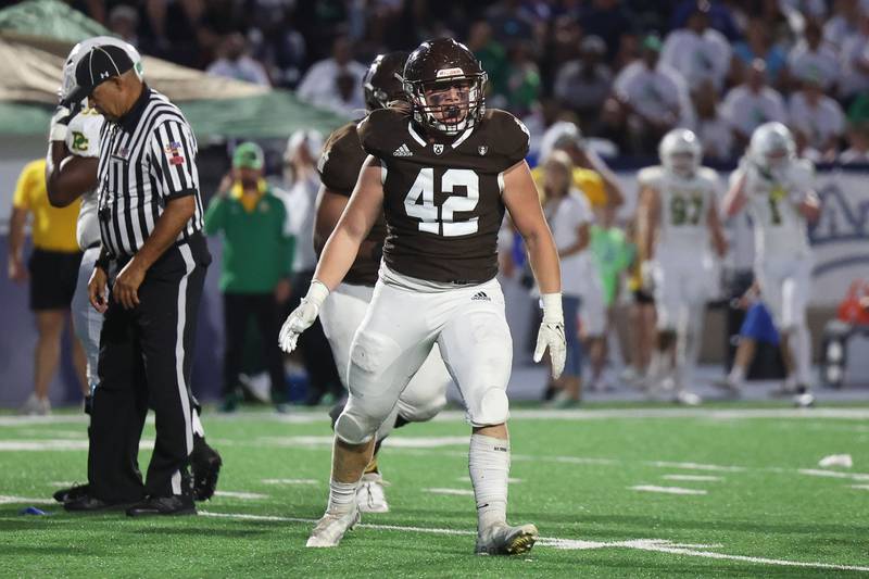 Joliet Catholic’s Daniel Rouse celebrates a Hilltoppers fumble recovery against Providence on Friday, Sept. 1, 2023 Joliet Memorial Stadium.