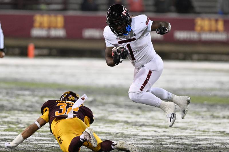 NIU quarterback Rocky Lombardi looks to pass against Central Michigan on Tuesday, October 31, 2023
