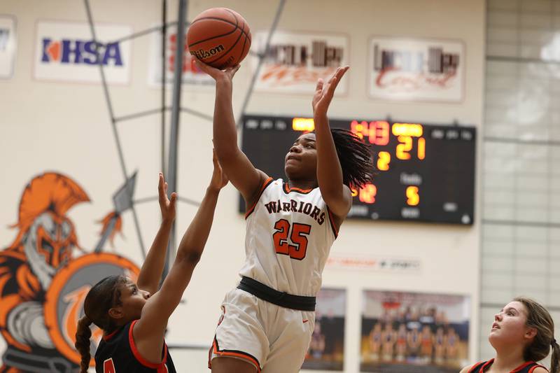 Lincoln-Way West’s Chyne Lewis puts up a shot against Lincoln-Way Central on Tuesday, February 7th..
