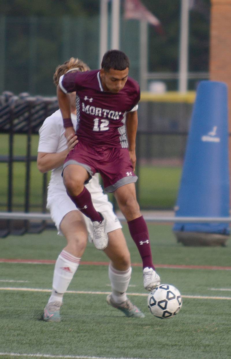 Morton West's Xavier Avila defends the ball against Naperville Central during their home game in Berwyn Monday, Aug. 21, 2023.