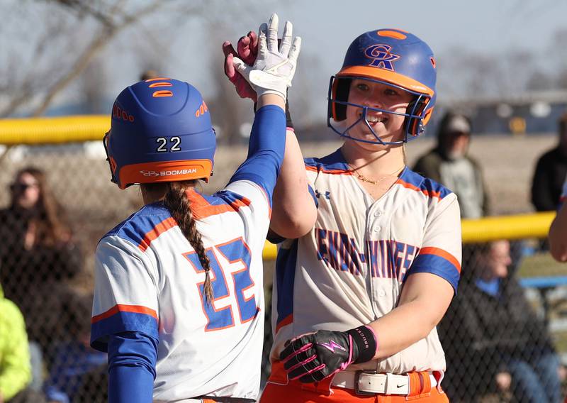 Genoa-Kingston's Elizabeth Davis (right) is congratulated after the first of her two home runs by teammate Brooklynn Ordlock Monday, March 23, 2026, during their game at Hinckley-Big Rock High School.