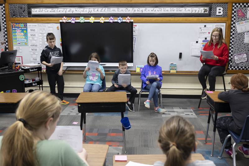 East Coloma-Nelson third-grade teacher Lisa Brininger works with her class on a reading and discussion assignment Friday, March 24, 2023.