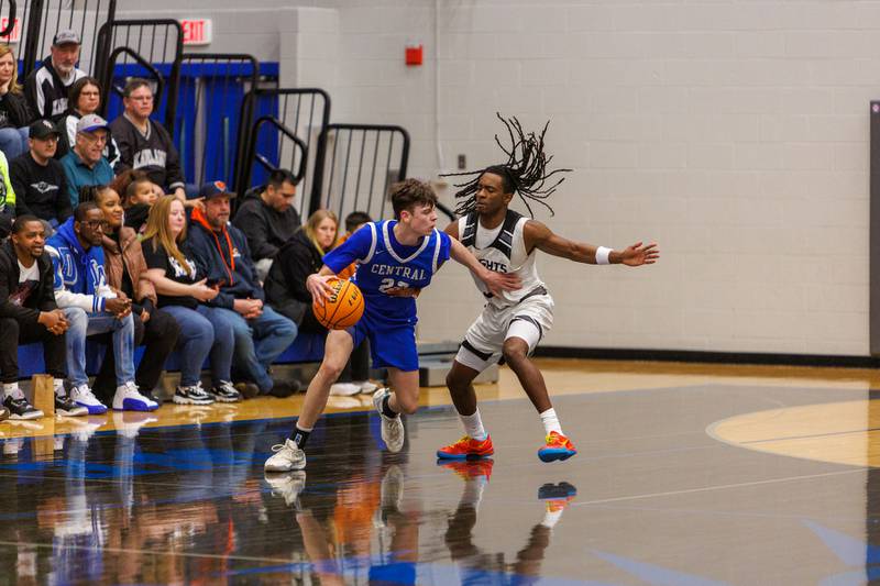 Burlington Central's Joseph Cumpta looks to drive to the basket against Kaneland's Marshawn Cocroft at the Class 3A Burlington Central Regional Final on Friday, Feb. 27,2026 in Burlington.
