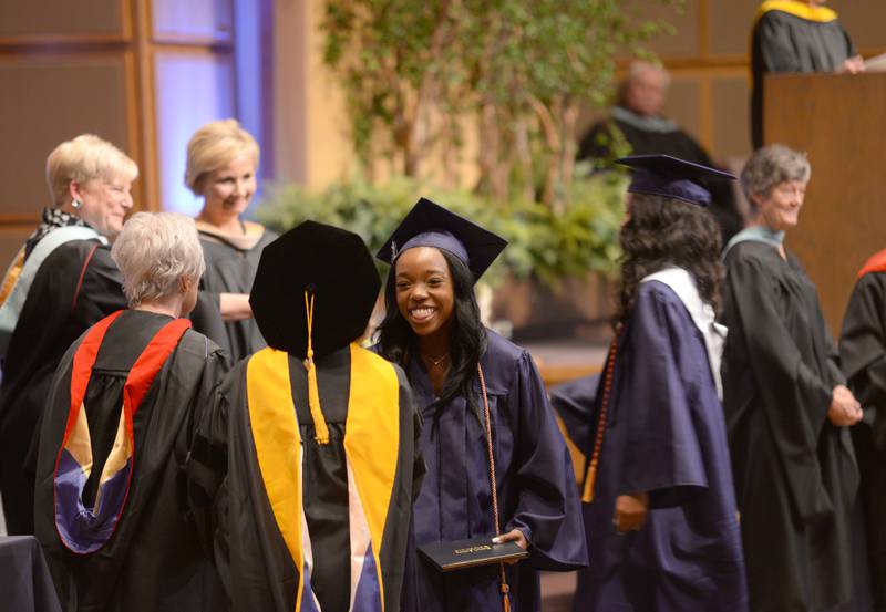 Nazareth graduates including Leilani Angelese Jackson receive their diplomas during the mass and graduation held on Sunday, May 18, 2025 at Christ Church of Oak Brook.