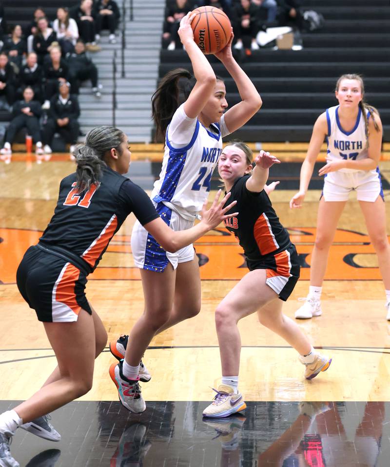 Wheaton North's Sara Abdul passes out of a DeKalb double team during their Class 4A regional game Monday, Feb 12, 2024, at DeKalb High School.