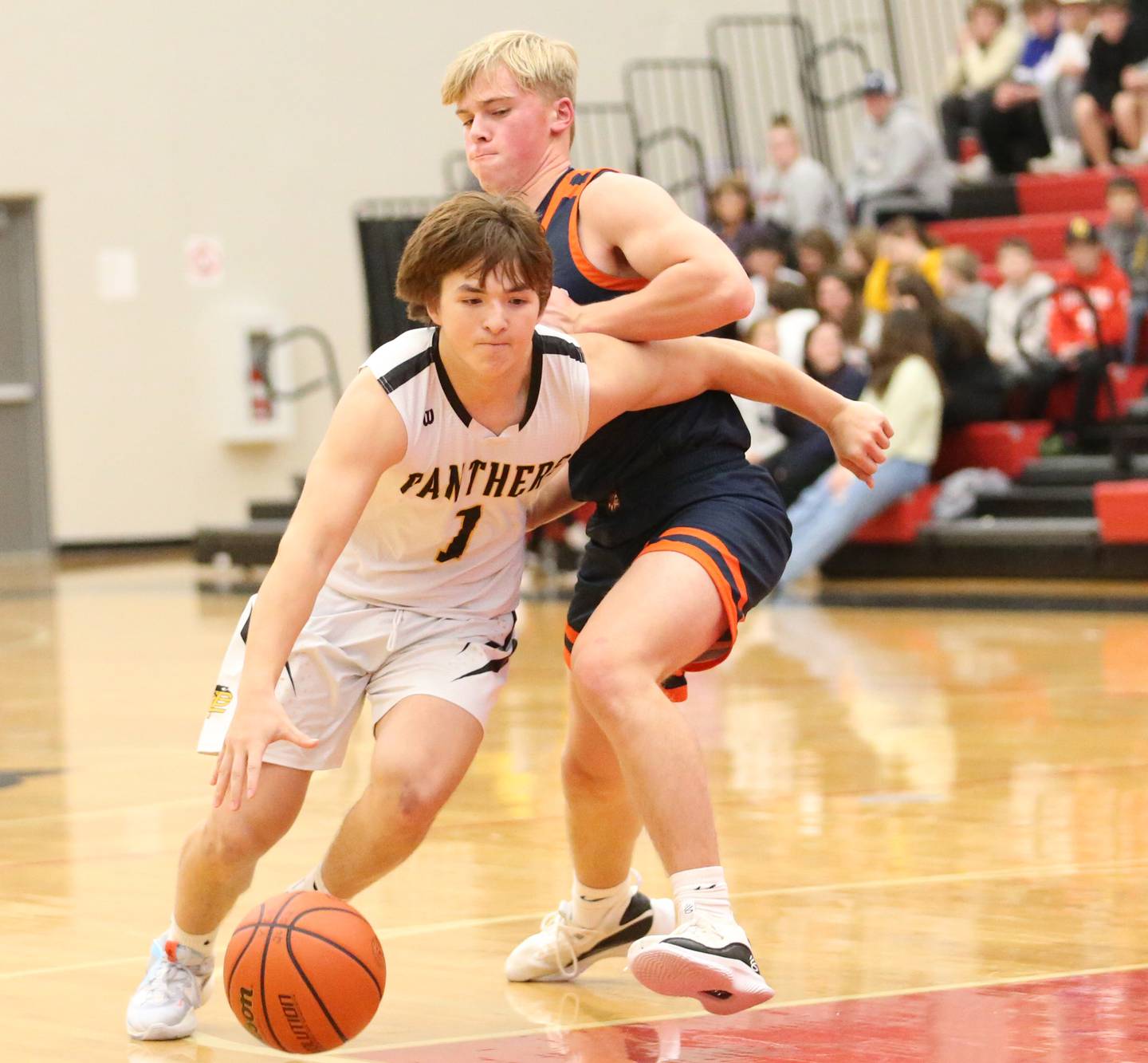 Putnam County's Owen Saepham (left) works around Pontiac's Aithen Sullivan (right) to run into the lane during the Colmone Classic tournament on Friday, Dec. 9, 2022 at Hall High School in Spring Valley.