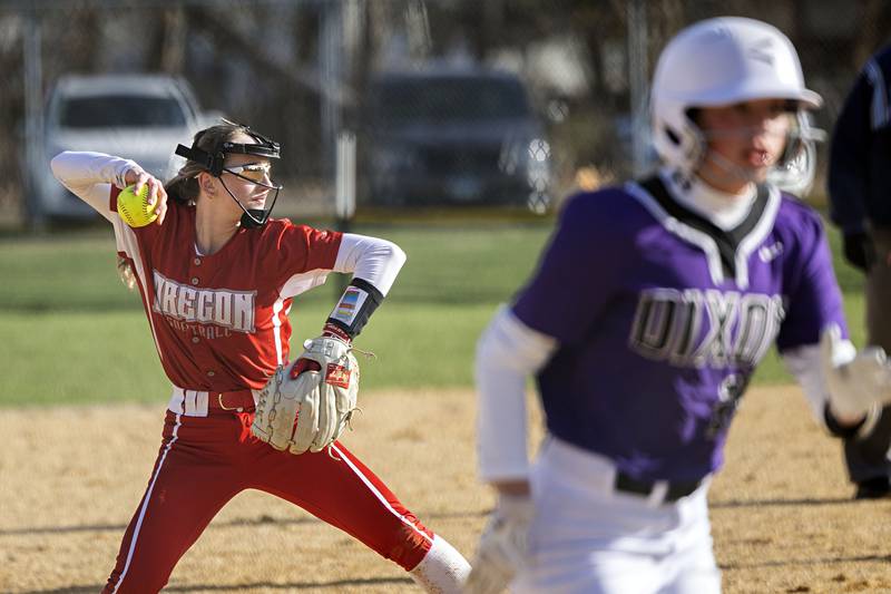 Oregon’s Ella Dannhorn throws to first for an out Wednesday, April 5, 2023 against Dixon.