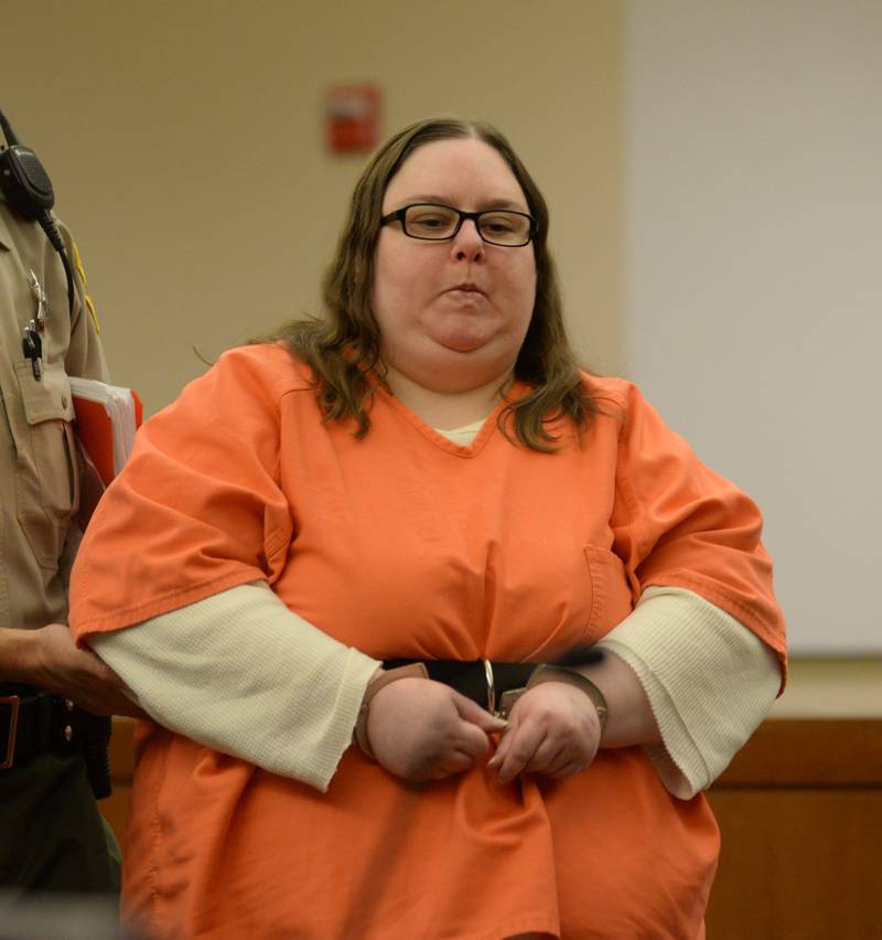 Sarah Safranek is escorted into an Ogle County courtroom on Thursday, May 18 for a status hearing. She is charged with the murder of her 7-year-old son Nathaniel.