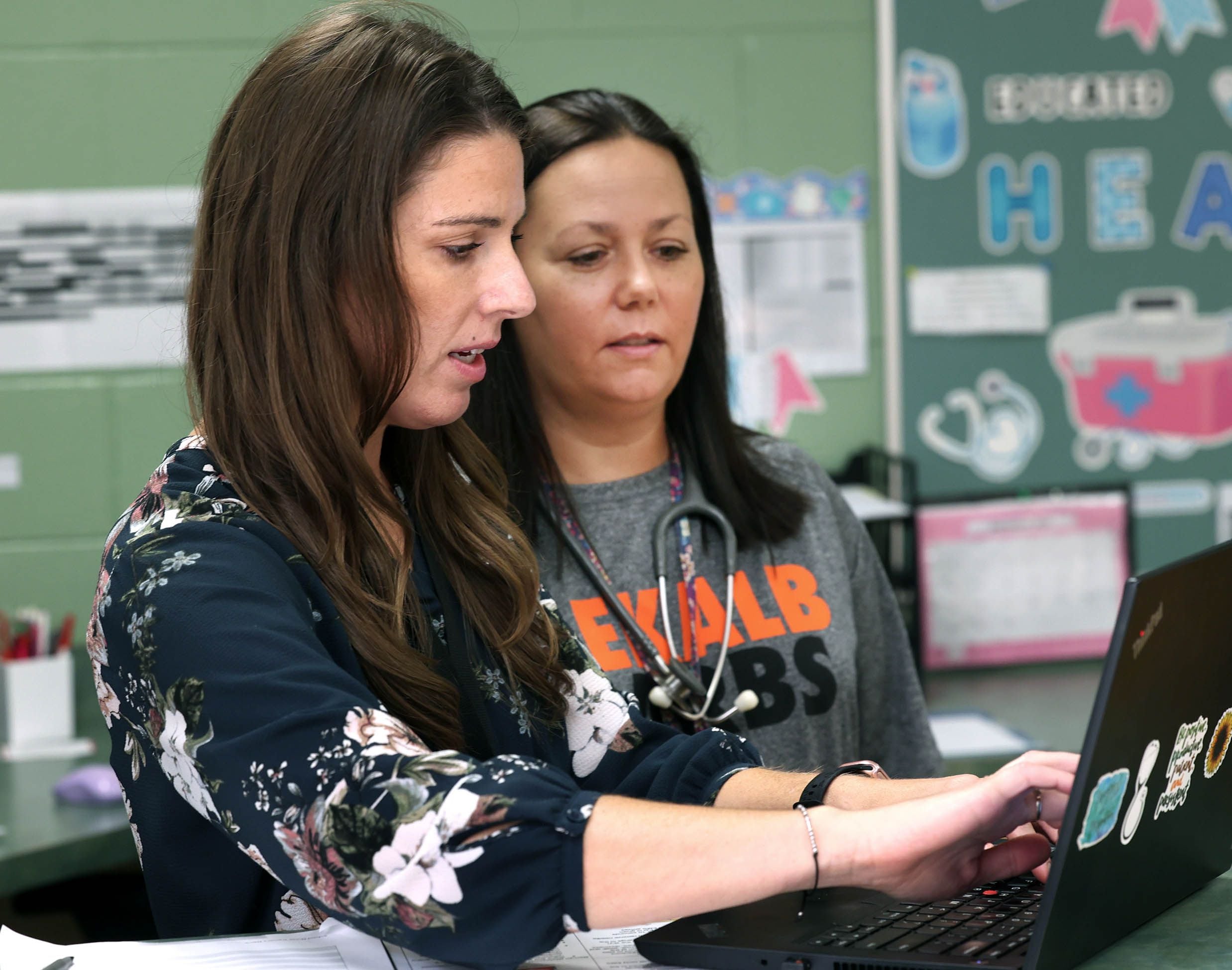 Stephanie Condon, (left) the nursing manager for DeKalb School District 428, and Kristin Perez, a certified school nurse in the district, talk Monday Sept. 22, 2025, in the nurses office at Brooks Elementary School.