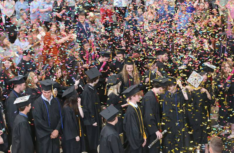 Putnam County High School Class of 2025 graduates pop confetti during the 59th annual Commencement on Sunday, May 18, 2025 in R.M. Germano gymnasium.