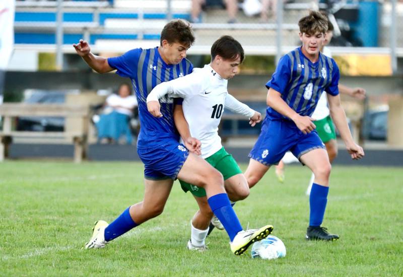 Princeton's Asa Gartin (left) and Chase Sims battle against Alleman Thursday night at Bryant Field. The visiting Pioneers won 8-0.