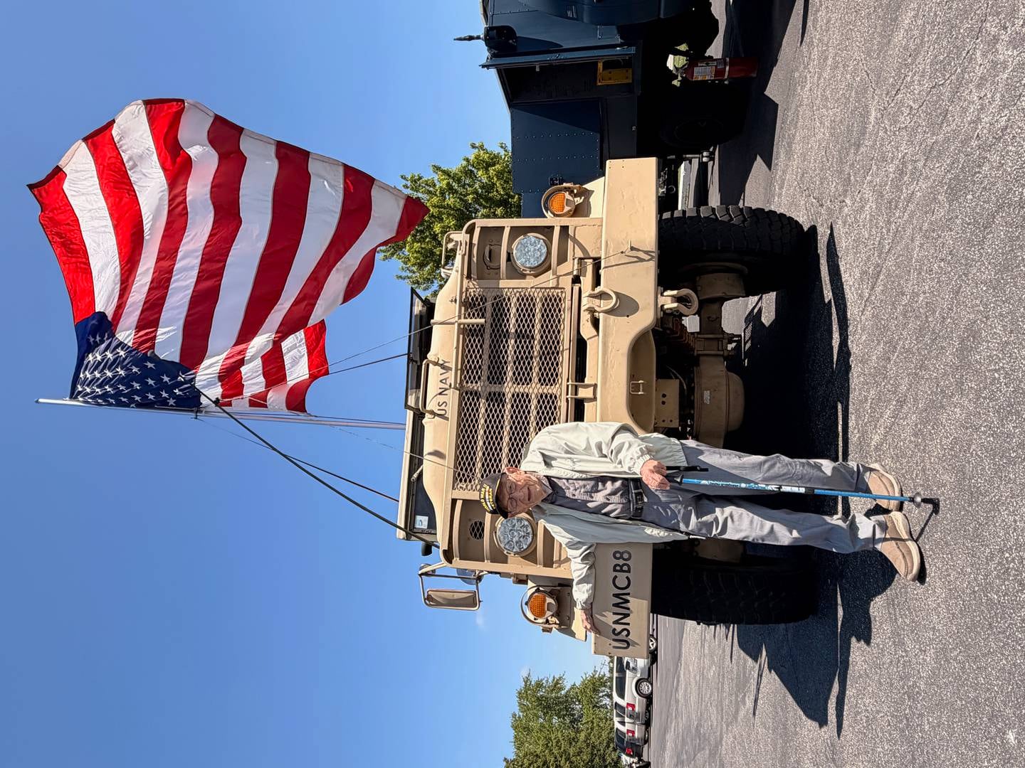 Virgil Foster, 99, of St. Anne, is shown under the American flag and in front of a military vehicle at the services. Foster served on Guam during World War II, making him one of the last veterans from that conflict.