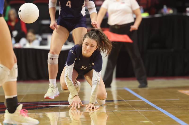 IC Catholic’s Kiely Kemph comes up shot on a dig against Genoa-Kingston in the Class 2A championship match on Saturday in Normal.