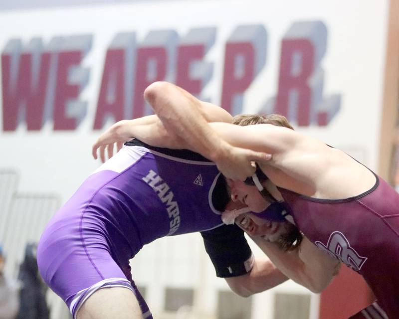 Prairie Ridge’s Matt Moritz, right, battles Hampshire’s Mike Brannigan at 157 pounds in varsity boys wrestling on Thursday, Dec. 4, 2025, at  Prairie Ridge High School in Crystal Lake.