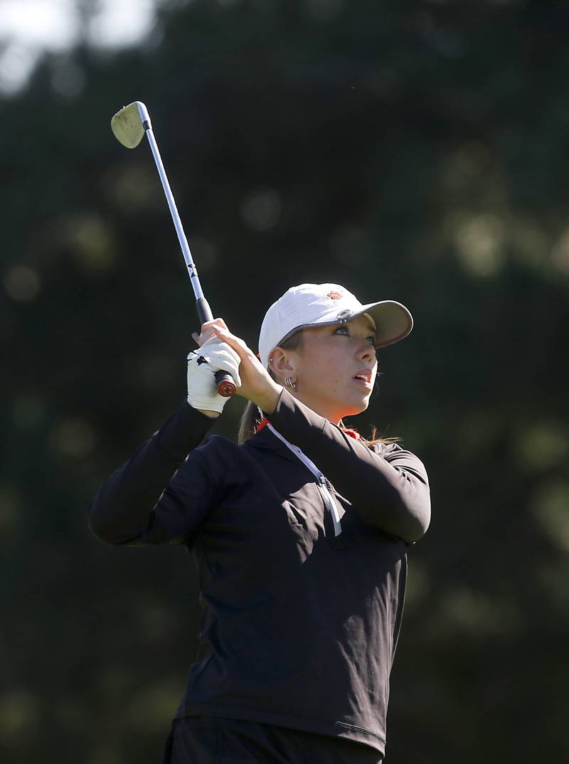 Crystal Lake Co-op’s Delaney Medlyn watches her tee shot the eight hole during the IHSA Class 2A Huntley Girls Golf Regional on Tuesday, Oct. 1, 2024, at Pinecrest Golf Club in Huntley.