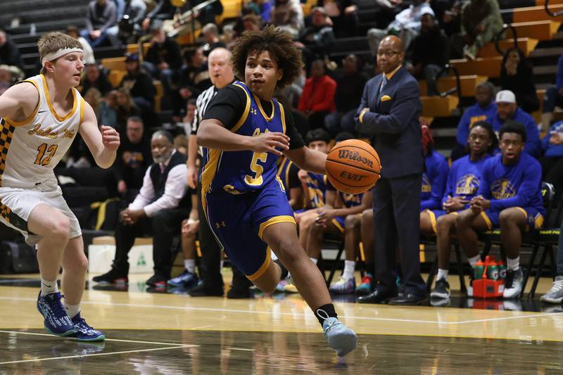 Joliet Central’s Michael Smith drives to the basket against Joliet West on Tuesday, Feb. 17, 2026 in Joliet.