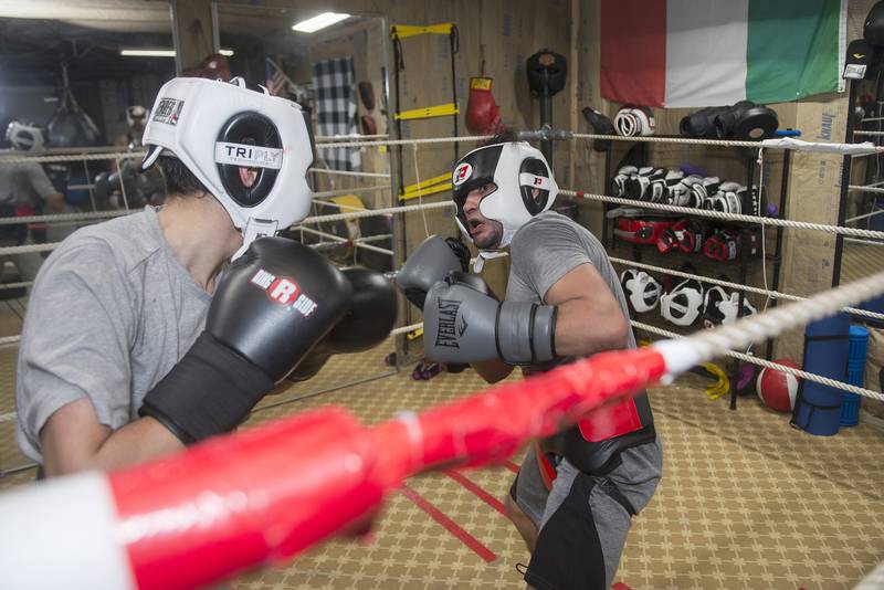 Javier Marquina, 30, of East Moline works out with Alex Mazzarisi, 20, in Sterling. Marquina travels in from the Quad Cities to train at the Sterling gym run by Alex’s father Steve. Marquina, a professional boxer, faces off against Lupe Jimenez Feb. 12 in the QC. “It’s a great group of guys here,” Marquina said about the gym.