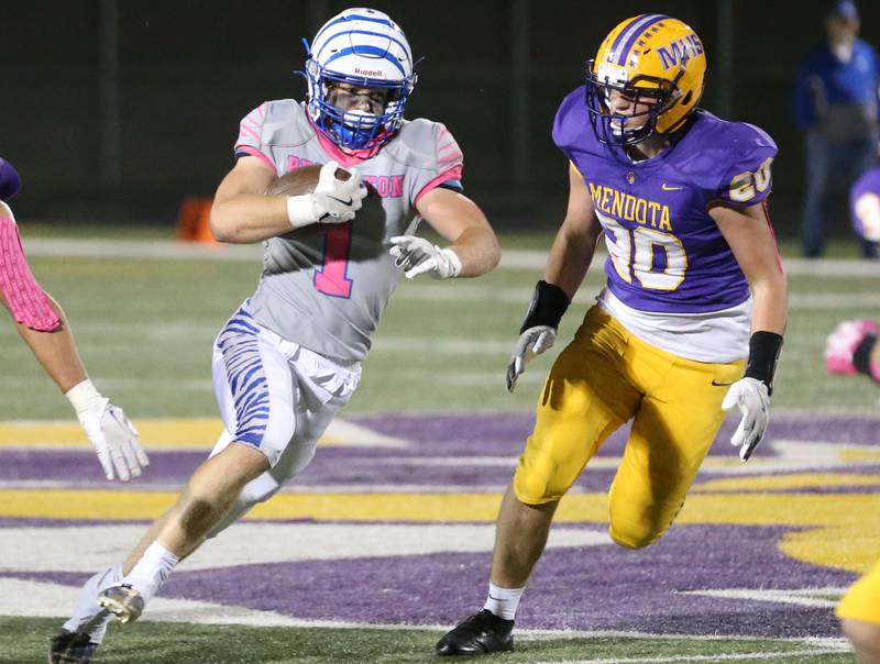 Princeton's Casey Etheridge carries the football past Mendota's Wyatt Ossman on Friday, Oct. 11, 2024 at Mendota High School.
