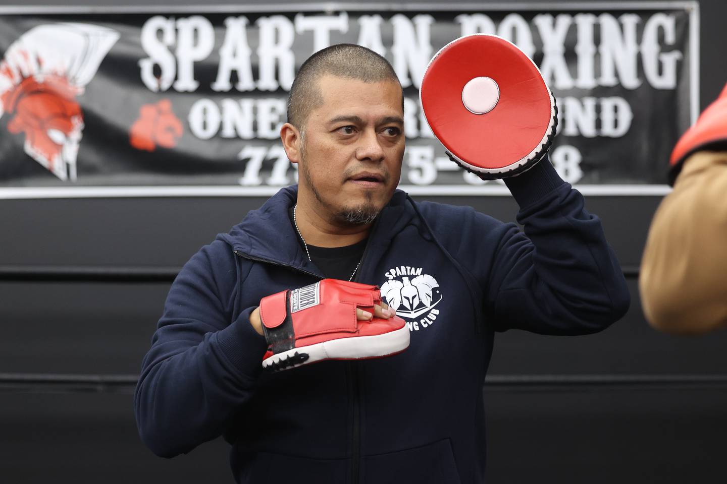 Co-owner Oscar Hernandez does a sparing demonstration at the ribbon cutting ceremony for his training facility Spartan Boxing on Wednesday, Nov. 8, 2023 in Lockport.