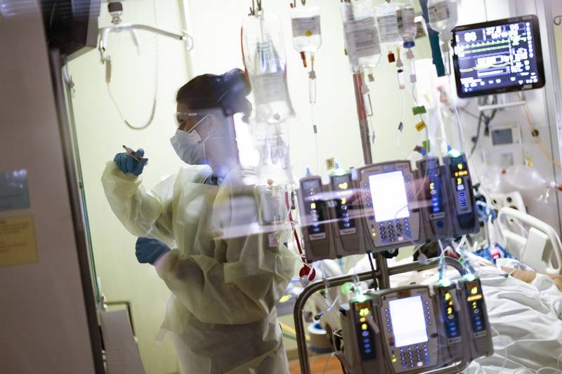 FILE - In this Aug. 31, 2021, file photo, Ann Enderle R.N. attends to a COVID-19 patient in the Medical Intensive care unit (MICU) at St. Luke's Boise Medical Center in Boise, Idaho. COVID-19 deaths in the U.S. have climbed to an average of more than 1,900 a day for the first time since early March, with experts saying the virus is preying largely on a select group: 71 million unvaccinated Americans.