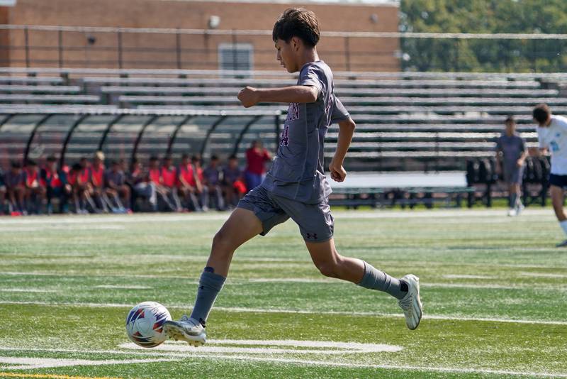 Morton’s Giovanni Roman (14) moves the ball up the field on a fast break during a soccer match against Downers Grove South at Morton High School in Berwyn on Saturday, Oct. 5, 2024.