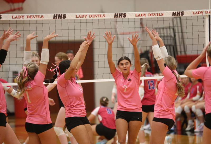 Hall's Haven Rossi (center) reacts with teammates after scoring a point against Princeton on Thursday, Oct. 9, 2025 at Hall High School.