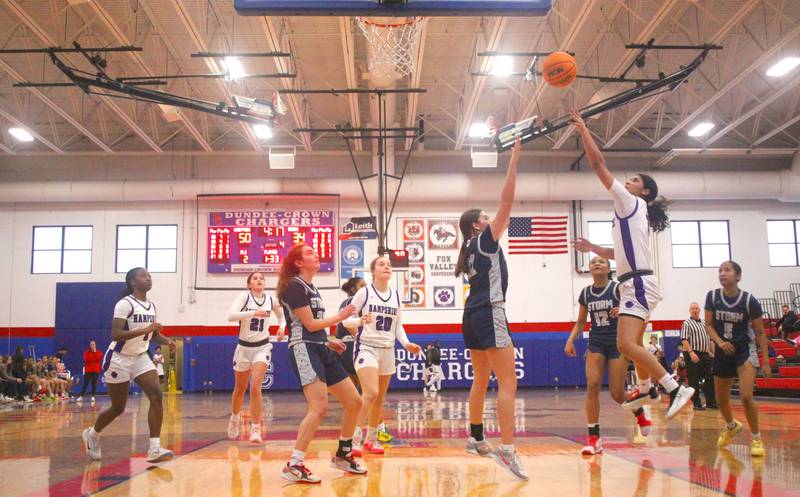 Hampshire’s Jiselle Lopez takes a shot against South Elgin in varsity girls basketball Komaromy Classic tournament  action on Monday, Dec. 29, 2025, at Dundee-Crown High School in Carpentersville.