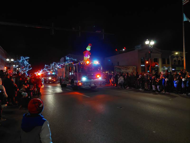 Fire trucks lead off the Festival of Lights parade Friday, Nov. 24, 2023, in downtown Ottawa.